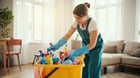 professional cleaner cleaning living room with cleaning caddy and supplies