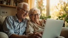 Senior citizen using affordable internet service on a tablet at home - low-cost internet for seniors on social security