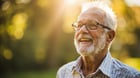 Senior man checking blood pressure with monitor at home - treatment of hypertension for seniors